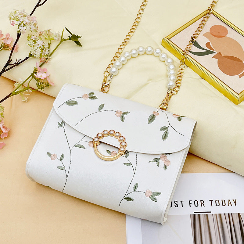 Wholesale bag with embroidered pearls and magnetic buckle chain